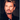 Portrait de Johnny Hallyday sur le tournage du clip de "Vivre pour le meilleur" en 1999 photographié par Daniel Angeli. Tirage d'époque en très bon état. 