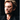 Portrait de Johnny Hallyday sur le tournage du clip de "Vivre pour le meilleur" en 1999 photographié par Daniel Angeli. Tirage d'époque en très bon état.